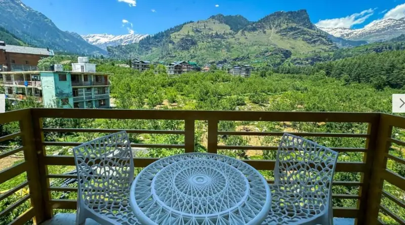 Wide mountain and valley view from a balcony at Dashaur Heights, Burwa