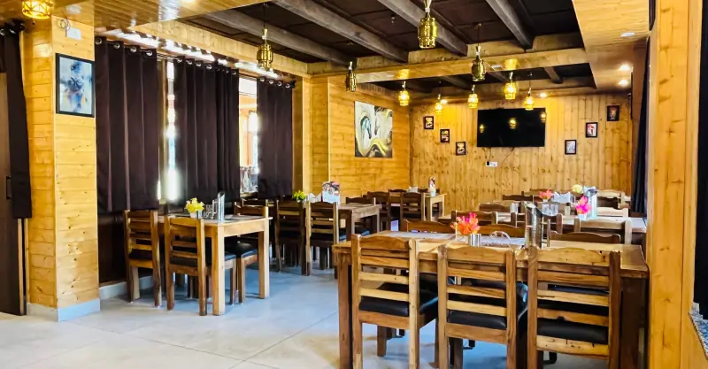 Wooden interiors of the in-house restaurant at Dashaur Heights