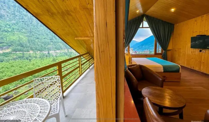 Room opening onto a private wooden balcony